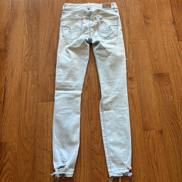 AMERICAN EAGLE NEXT LEVEL STRETCH DISTRESSED ROW HEM MID RISE LIGHT BLUE SIZE 00 - Picture 3 of 6